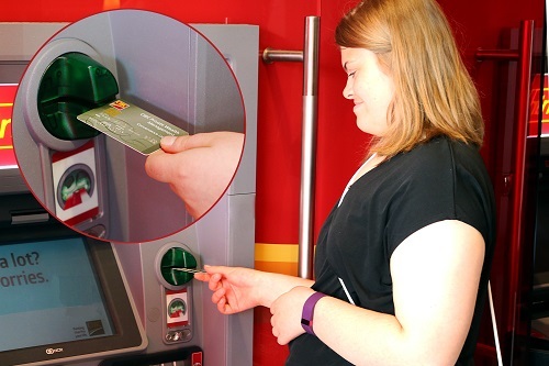 Woman using CIBC ATM.