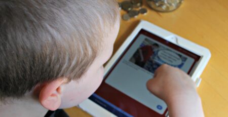 Child viewing the MagnusCards app in an iPad