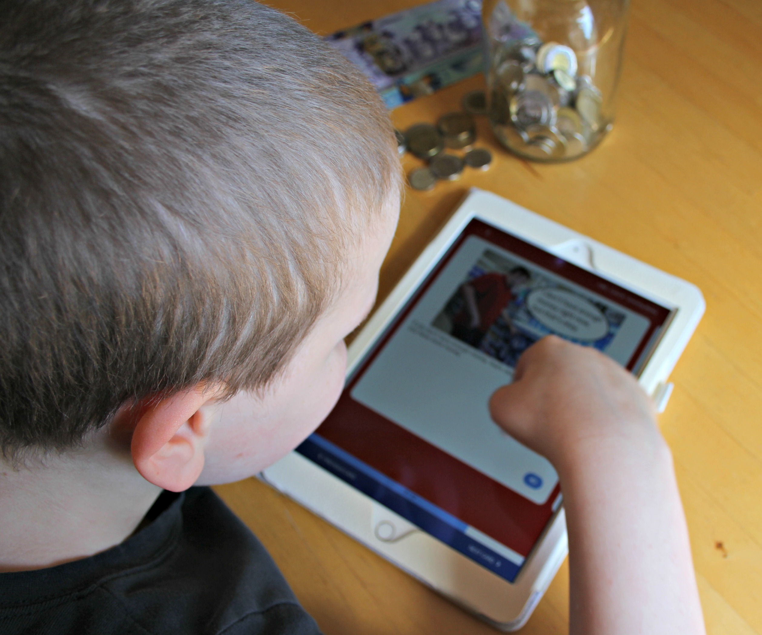 Child viewing the MagnusCards app in an iPad