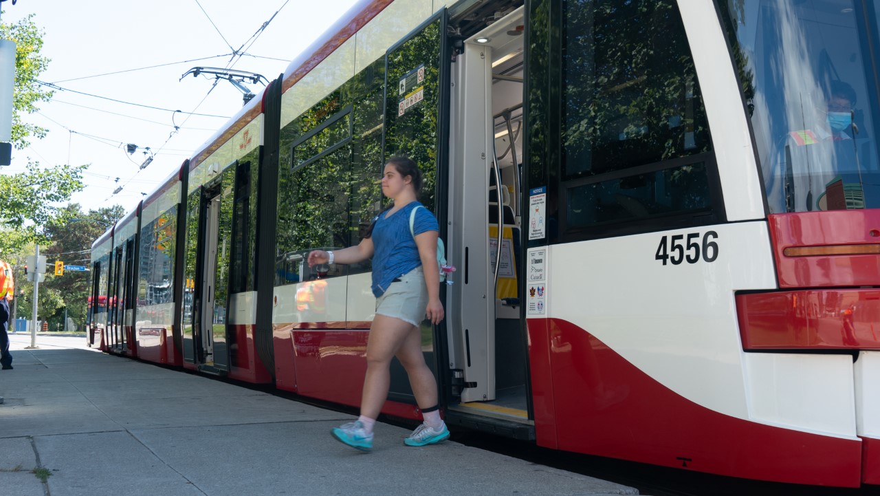 Woman leaving the TTC streetcar.